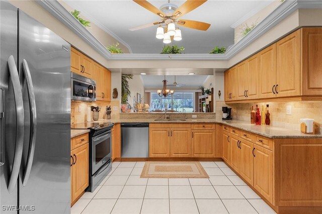 kitchen with crown molding, light tile patterned floors, sink, backsplash, and stainless steel appliances