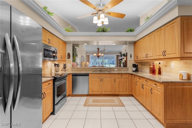 kitchen featuring light tile patterned floors, stainless steel appliances, a sink, and light stone countertops