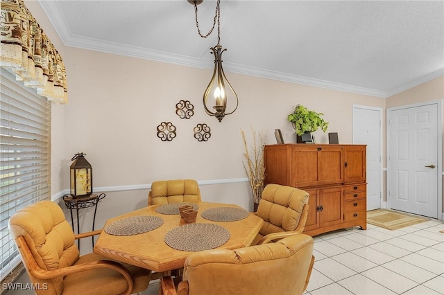 dining area featuring light tile patterned floors and crown molding