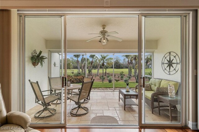 sunroom / solarium with ceiling fan