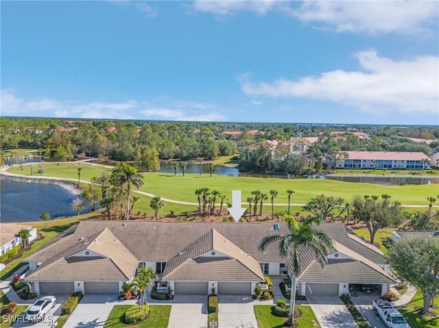 aerial view with view of golf course and a water view