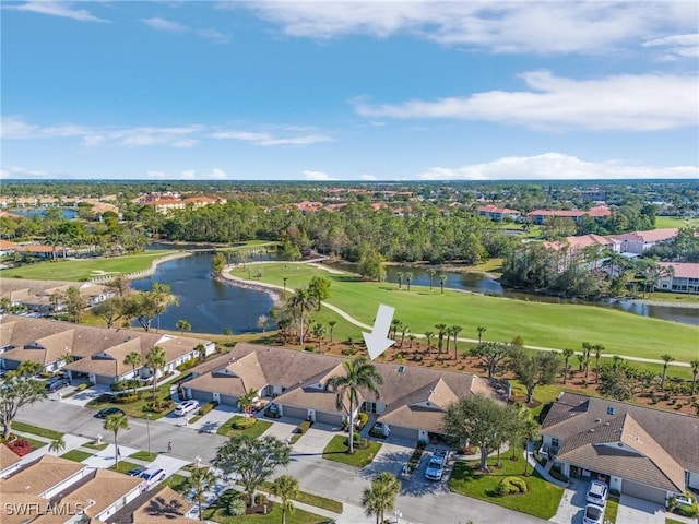 bird's eye view featuring view of golf course, a water view, and a residential view