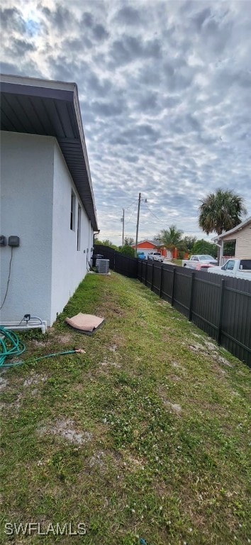 view of yard with central air condition unit