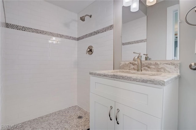 bathroom featuring vanity and a tile shower