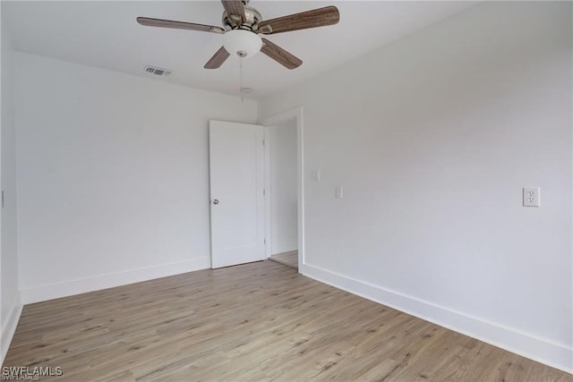 unfurnished room featuring ceiling fan and light wood-type flooring