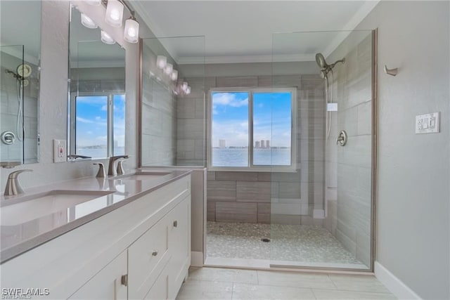 bathroom featuring vanity, crown molding, and tiled shower