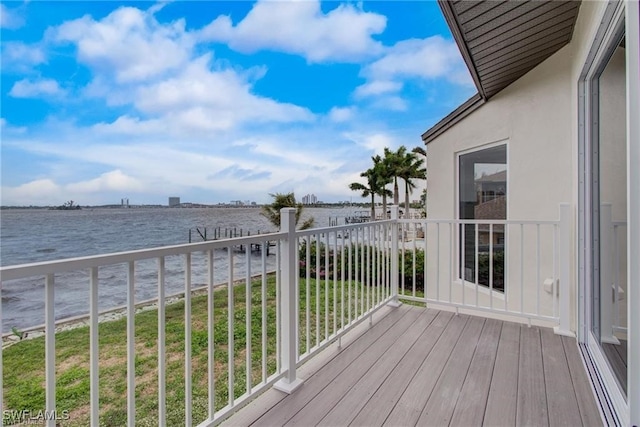 wooden deck featuring a water view