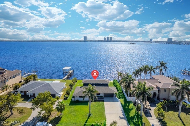 birds eye view of property with a water view