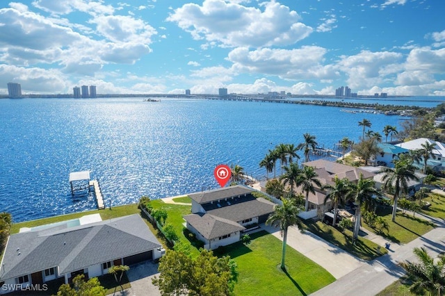 birds eye view of property with a water view