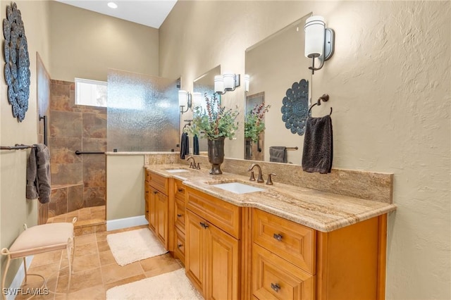 bathroom featuring vanity and a tile shower