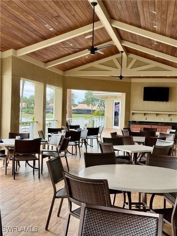 dining area featuring high vaulted ceiling, ceiling fan, wood ceiling, and beamed ceiling