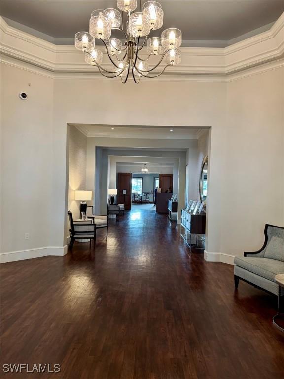 interior space featuring a notable chandelier and dark hardwood / wood-style floors