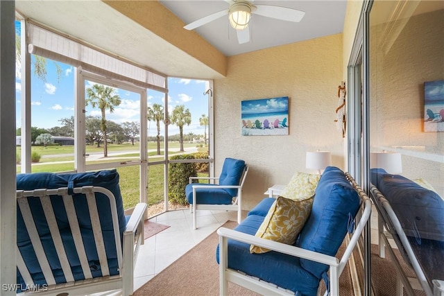 sunroom featuring ceiling fan