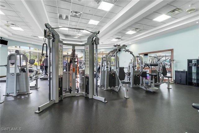 exercise room featuring a paneled ceiling