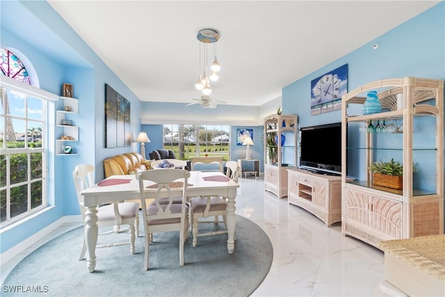 dining room featuring ceiling fan