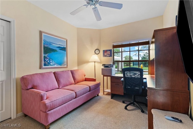 office with light carpet and ceiling fan