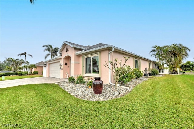 view of front of house with a garage and a front yard