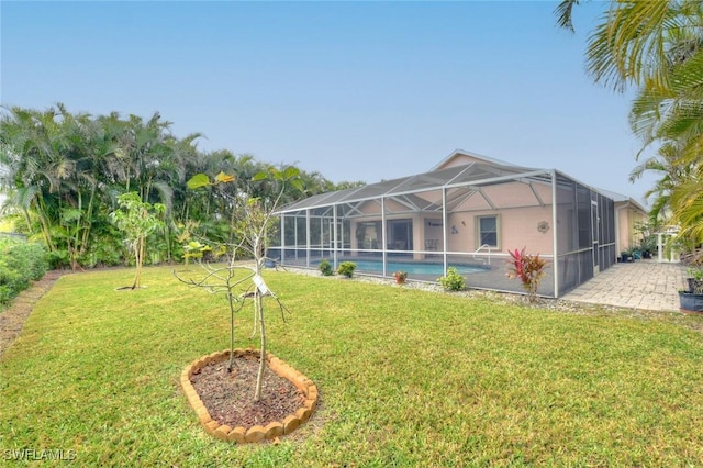 back of house featuring glass enclosure, a lawn, and a patio