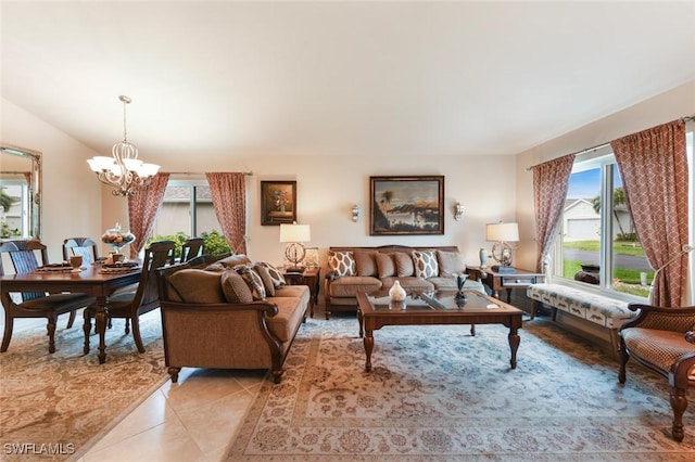 living room with light tile patterned floors and a notable chandelier