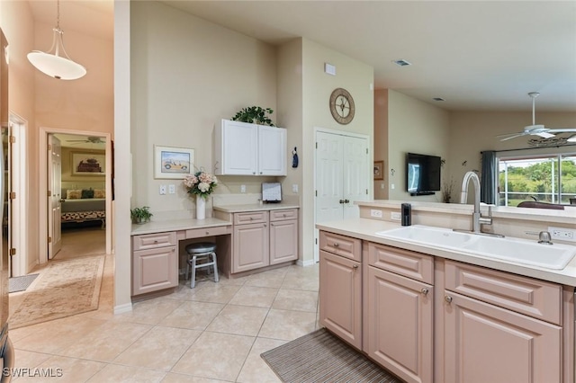 kitchen with sink, ceiling fan, light tile patterned floors, and pendant lighting