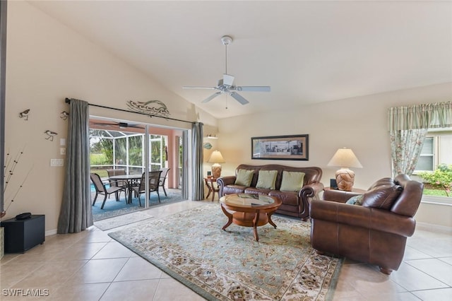 living room with vaulted ceiling, light tile patterned floors, and ceiling fan