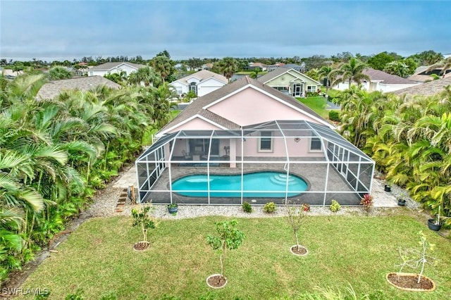 exterior space with a lawn and a lanai