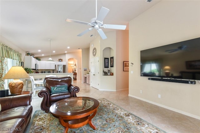 tiled living room featuring vaulted ceiling and ceiling fan