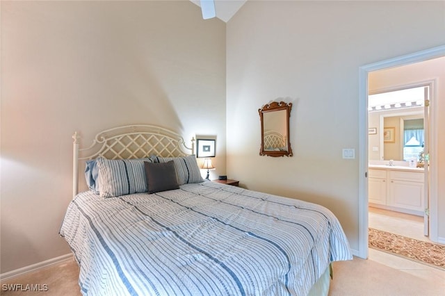 carpeted bedroom featuring ensuite bathroom