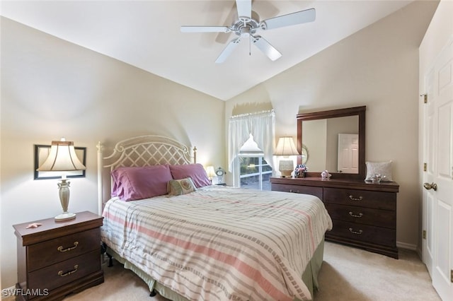 carpeted bedroom featuring lofted ceiling and ceiling fan