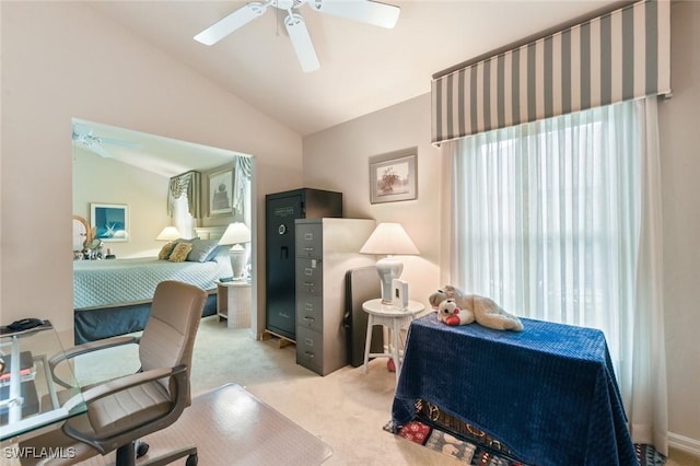 carpeted office featuring ceiling fan and vaulted ceiling