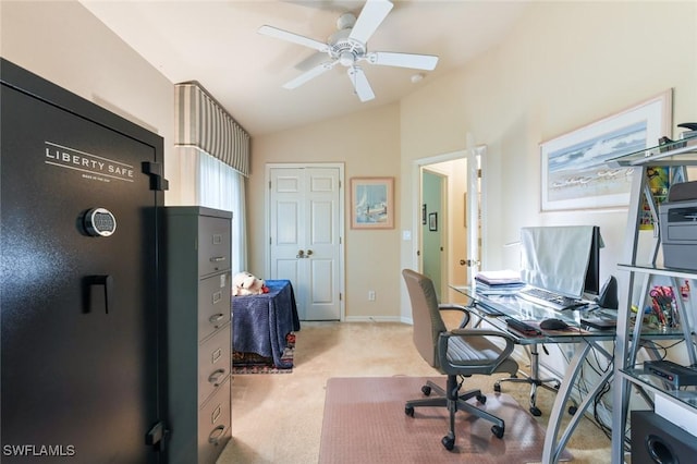 carpeted home office featuring vaulted ceiling and ceiling fan