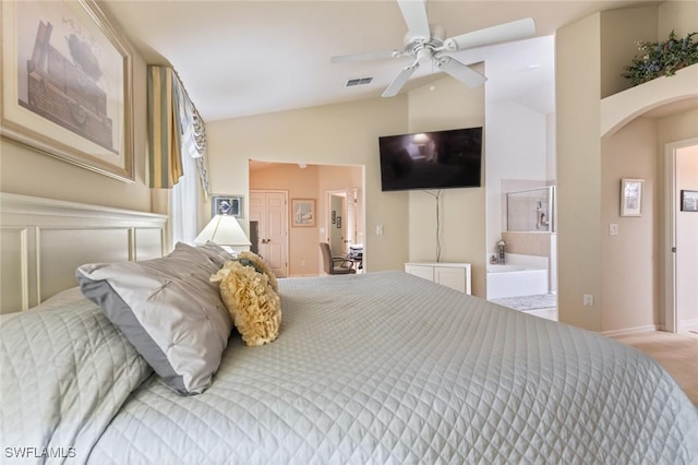 carpeted bedroom with ceiling fan and vaulted ceiling