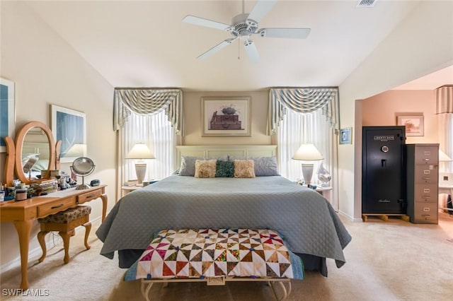 bedroom with ceiling fan, carpet floors, and vaulted ceiling