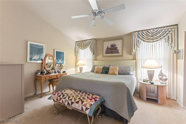 carpeted bedroom featuring ceiling fan and lofted ceiling