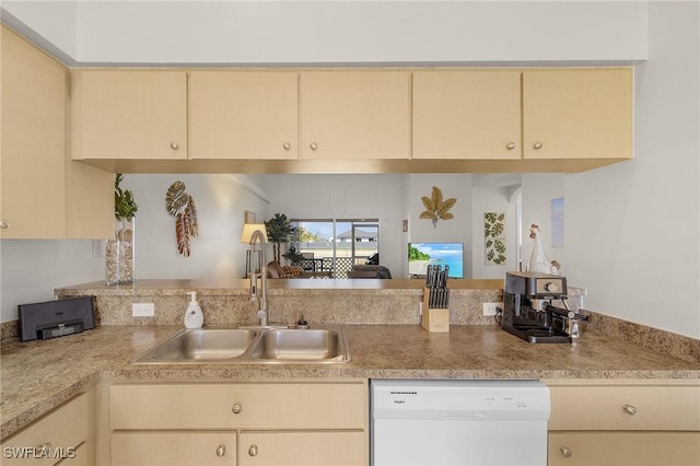 kitchen featuring sink, light brown cabinets, and dishwasher