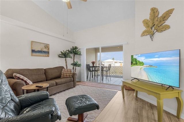 living room featuring ceiling fan and hardwood / wood-style floors