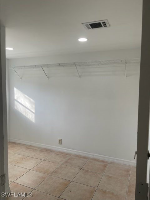 walk in closet featuring light tile patterned flooring