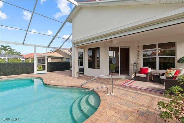 view of pool featuring an outdoor hangout area, a lanai, a patio area, and ceiling fan