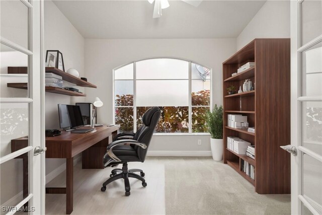 carpeted office with ceiling fan