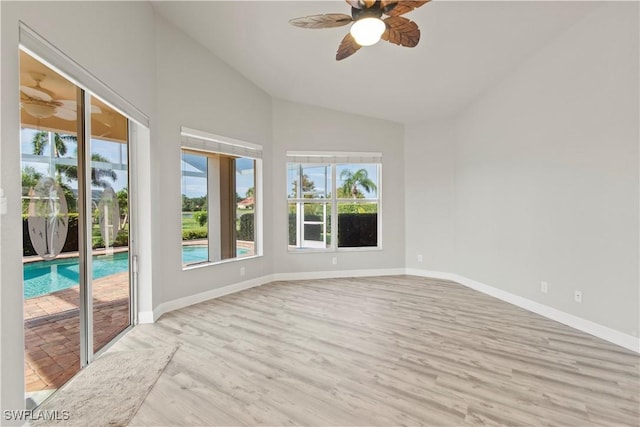 unfurnished sunroom with ceiling fan and lofted ceiling