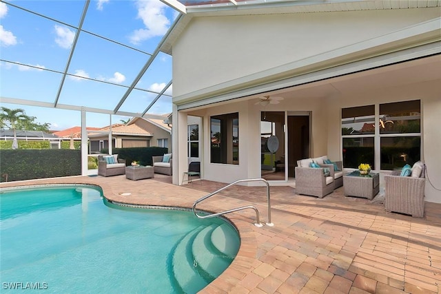 view of swimming pool with an outdoor living space, glass enclosure, and a patio area