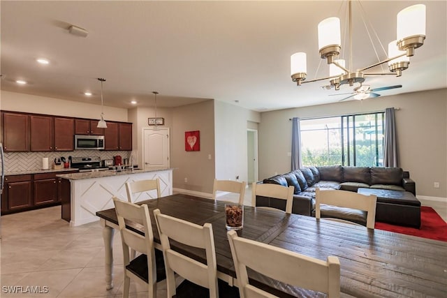 tiled dining area featuring a notable chandelier