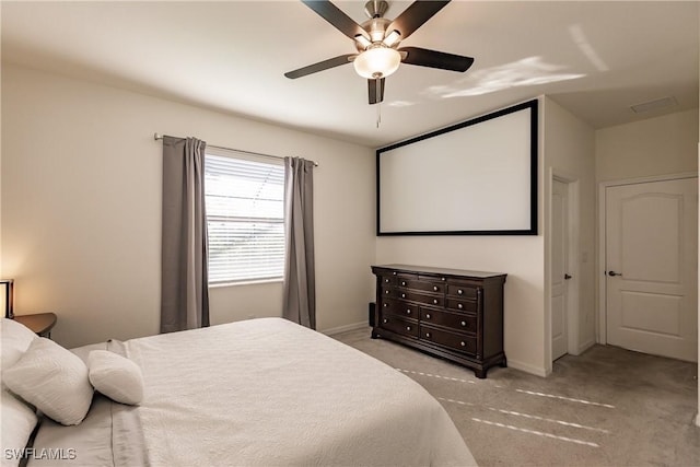 bedroom featuring ceiling fan and light colored carpet