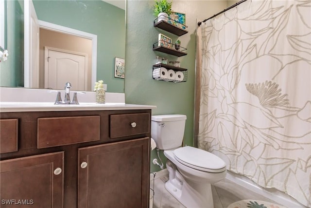 full bathroom featuring toilet, shower / tub combo, and vanity