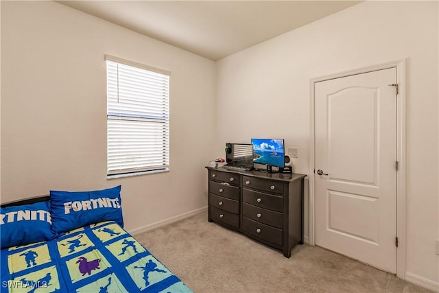 bedroom with light colored carpet