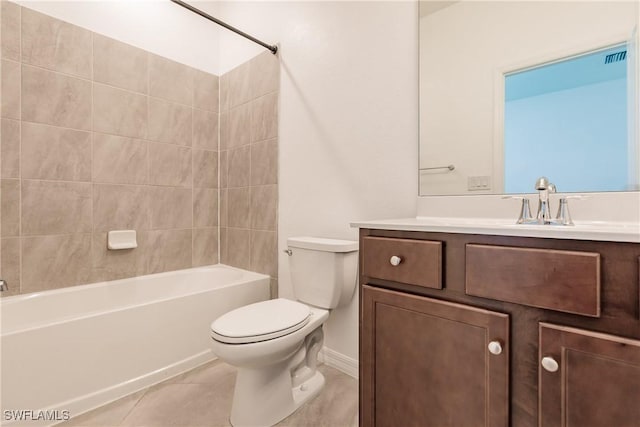 full bathroom featuring toilet, vanity, tile patterned flooring, and tiled shower / bath combo