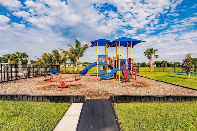 view of jungle gym featuring a lawn