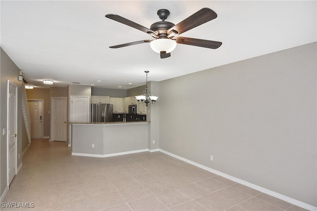8681 Athena Ct, Lehigh Acres, FL 33971 - unfurnished living room with a chandelier, ceiling fan, baseboards, and light tile patterned floors