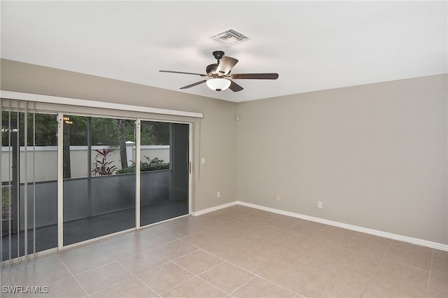 8681 Athena Ct, Lehigh Acres, FL 33971 - spare room with a ceiling fan, baseboards, and tile patterned flooring