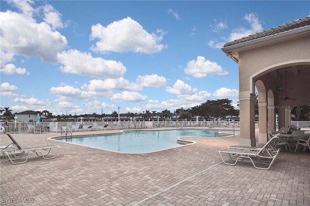 8681 Athena Ct, Lehigh Acres, FL 33971 - community pool with a patio